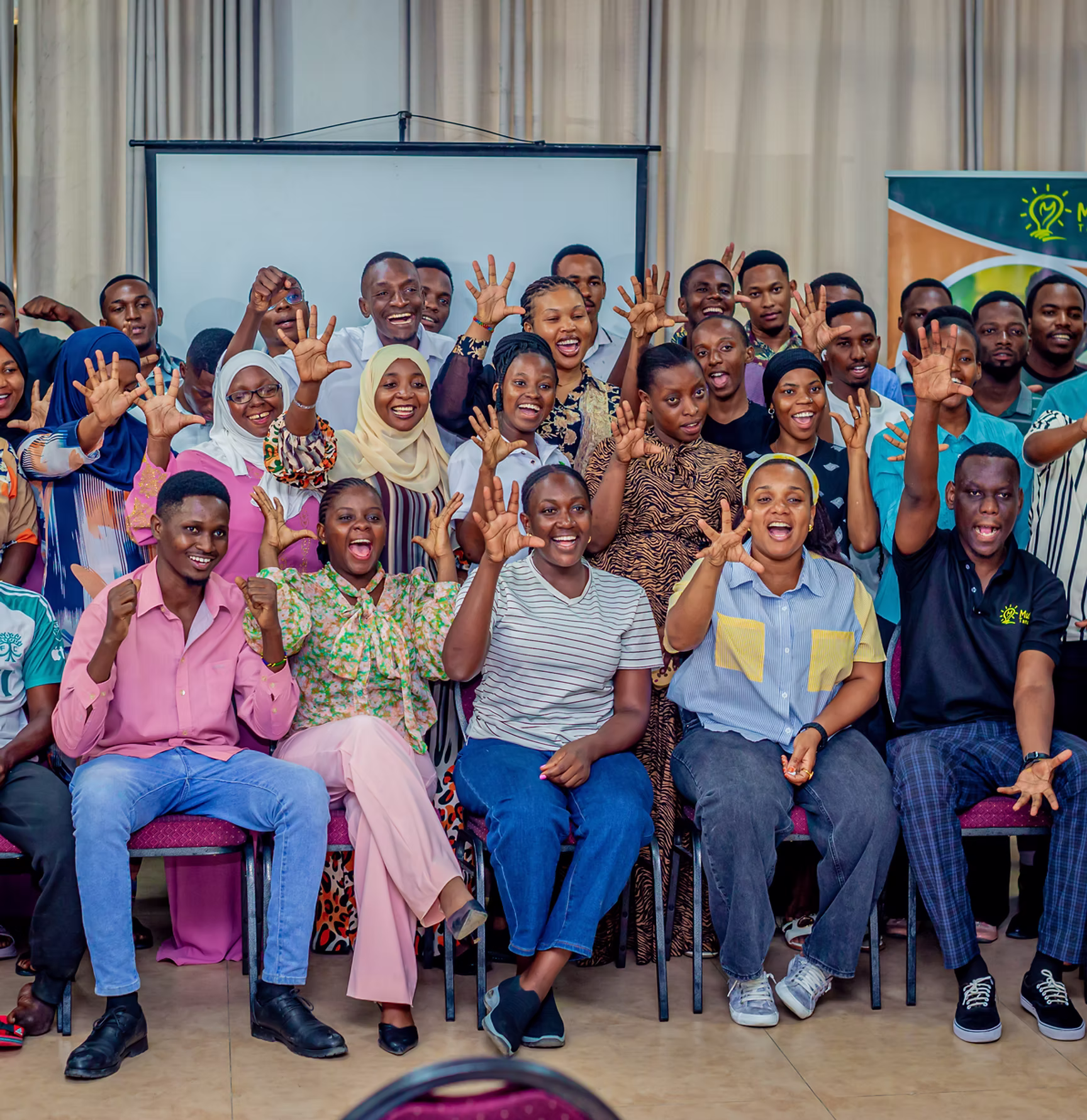 Young people celebrating together at a Mulika Tanzania event